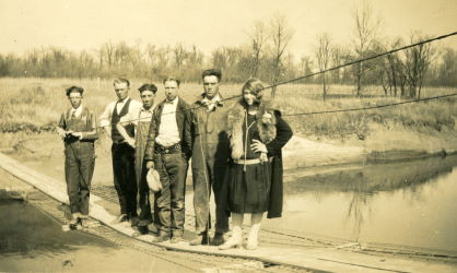 People posing with bridges