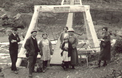 People posing with bridges