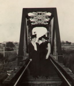 People posing with bridges