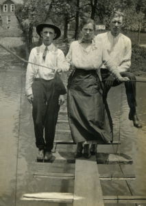 People posing with bridges