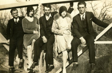 People posing with bridges