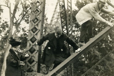 People posing with bridges