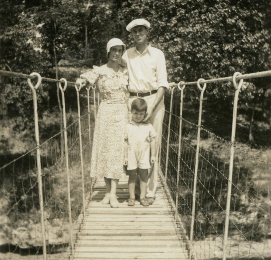 Folks by a suspension bridge